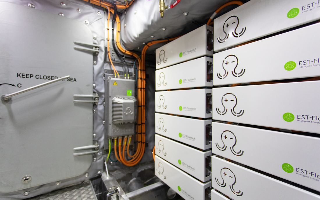 Marine-classed lithium battery modules installed in a vessel battery room.