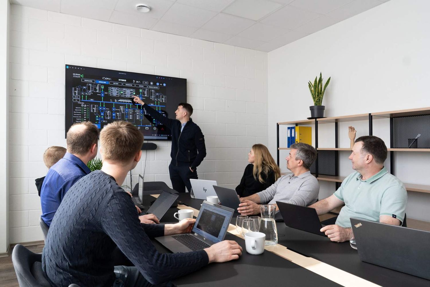 An NMTech design review with a hybrid single-line diagram on screen.